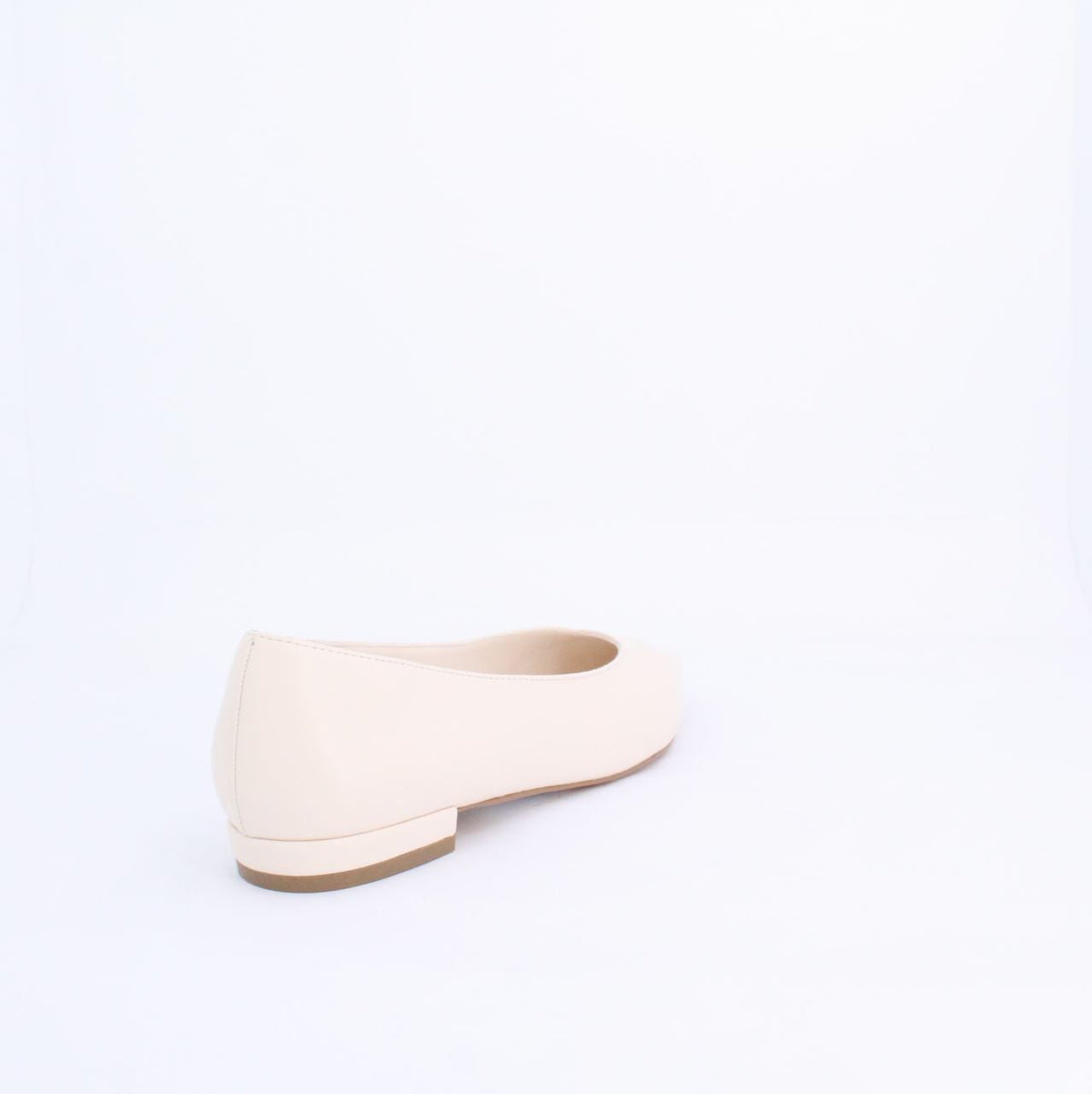 Cream Kiril flat pump style shoe with minimalist design and faux leather material, perfect for casual and formal outfits.