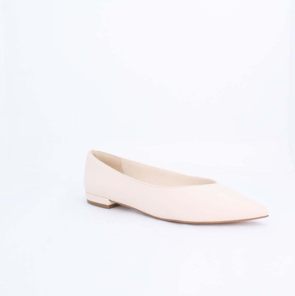 Cream flat pump style shoe with minimalist design and faux leather, featuring under 2cm heel, perfect for casual and formal outfits.