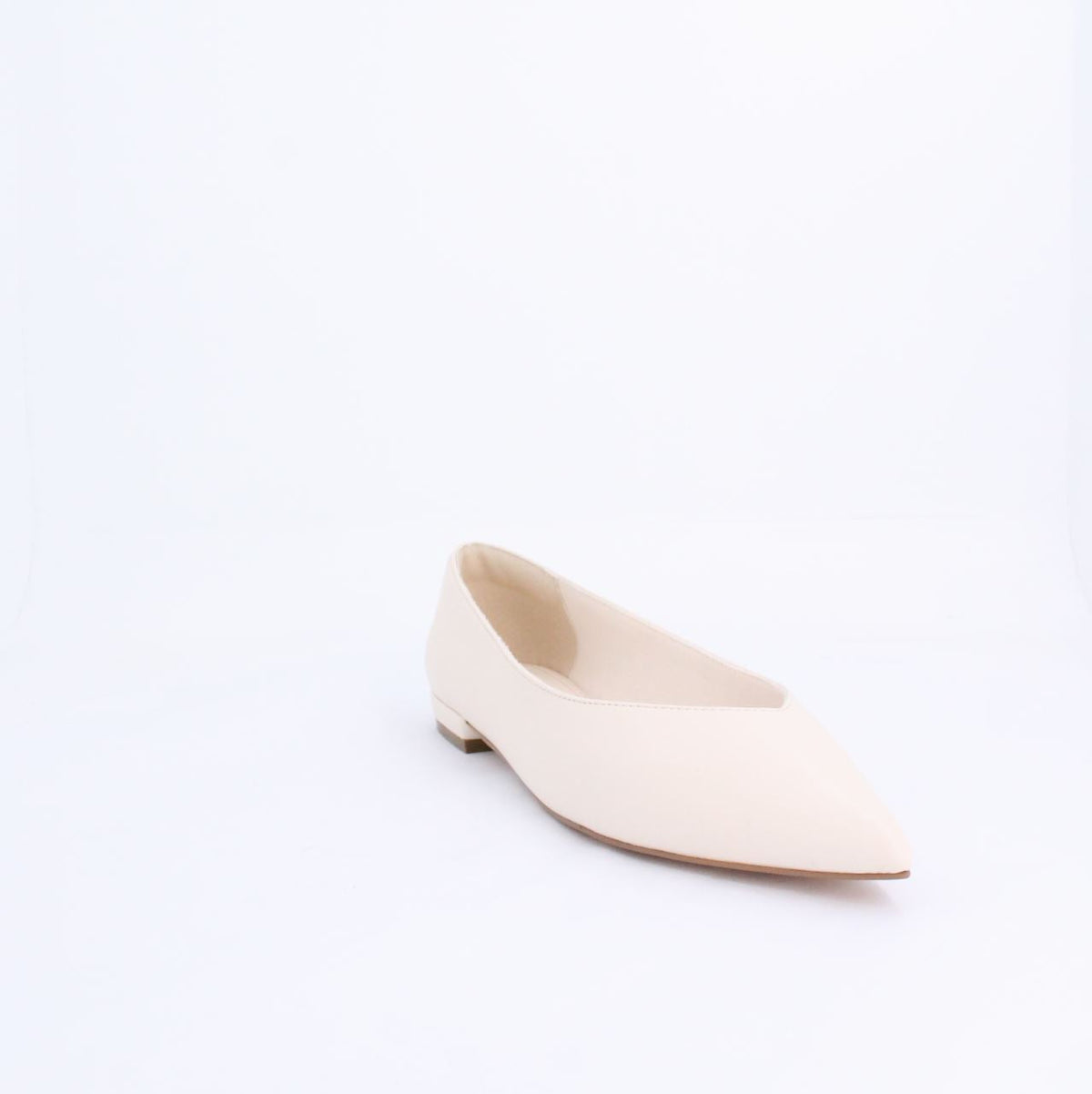 Cream Kiril pump flat shoe with minimalist design, made of faux leather. Under 2cm heel, ideal for casual and formal outfits.