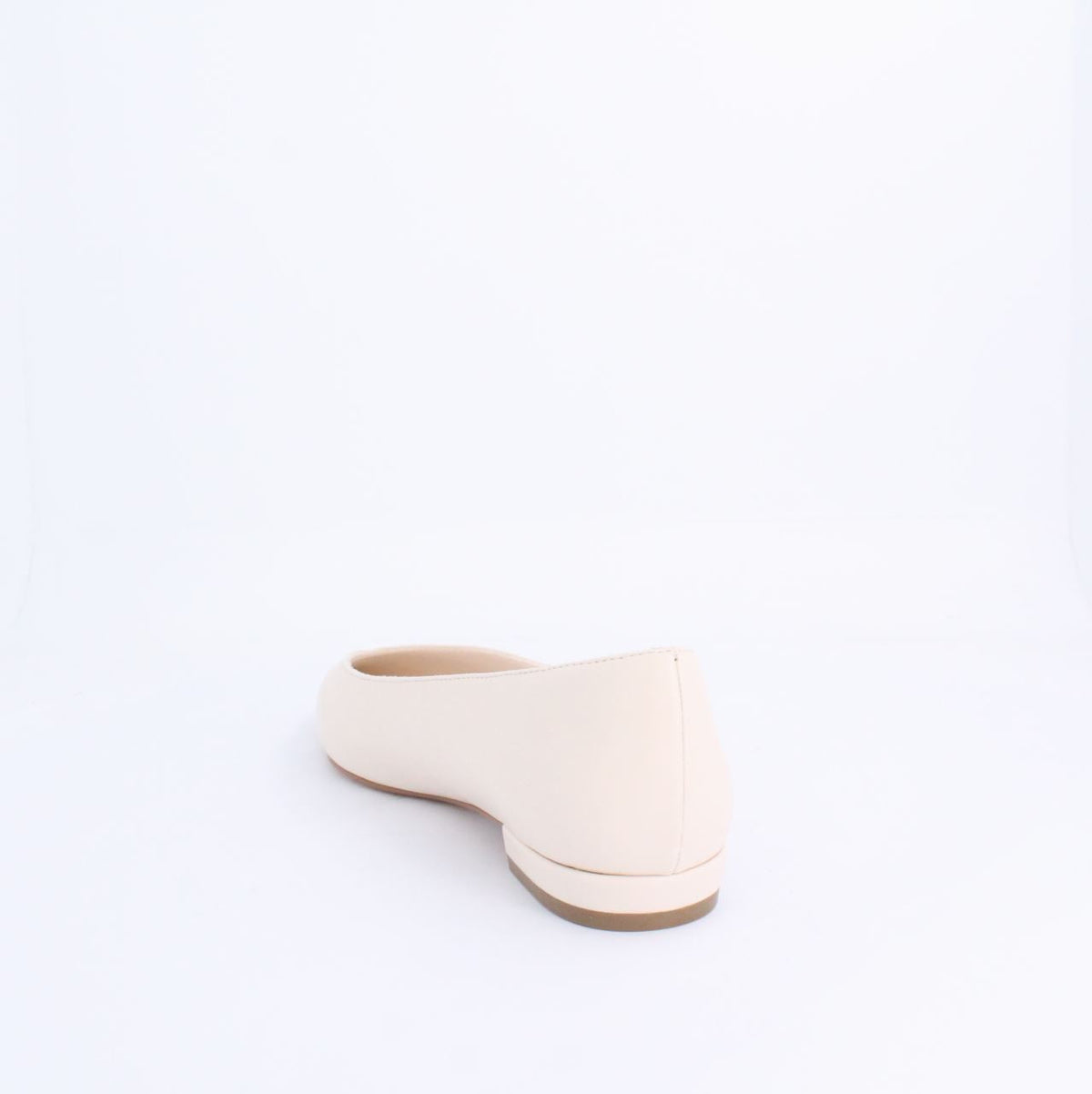 Cream colored Kiril Pump Flat with minimalist design, faux leather material, and under 2cm heel for versatile stylish wear.