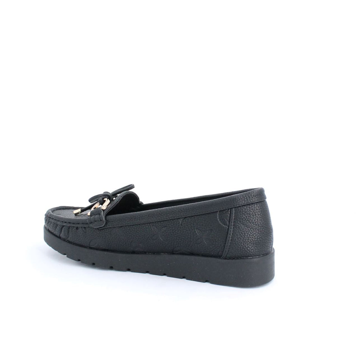 Black Adela moccasins with subtle embossed details and rubber sole, offering flexibility and traction for versatile everyday wear.