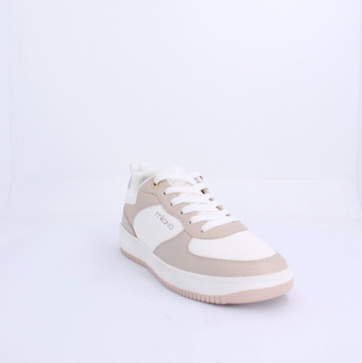 Alexis nude sneakers by Milano featuring soft beige and white design with white laces and subtle branding.