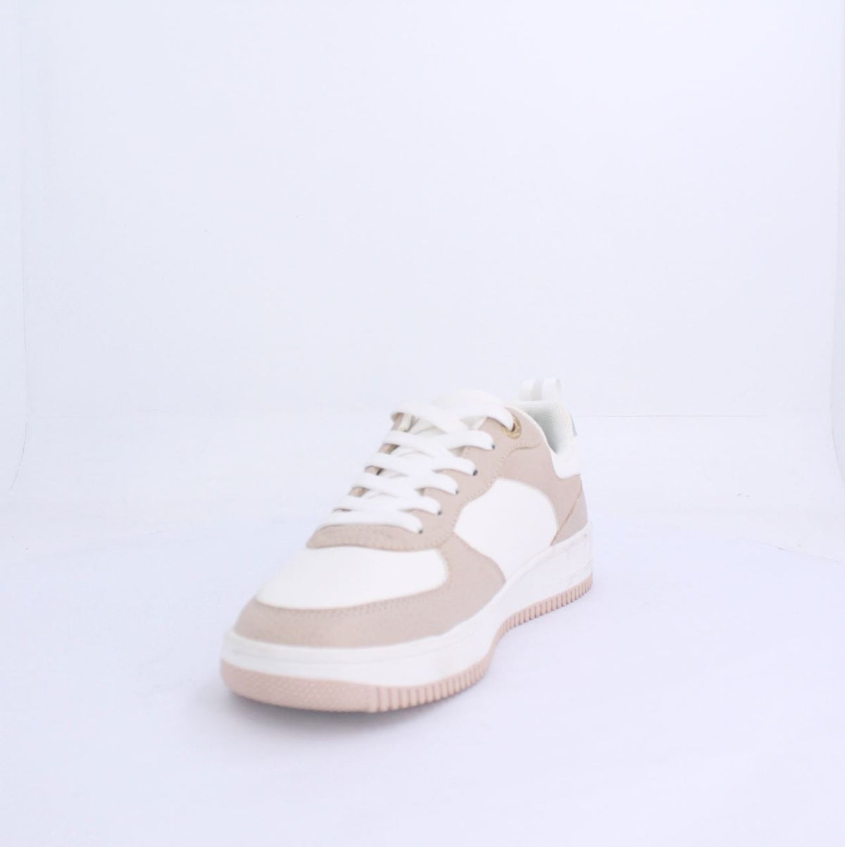 Nude Alexis sneakers with soft beige and white design, white laces, and Milano branding, showcasing a modern, casual style.